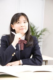 a middle school girl studying at school