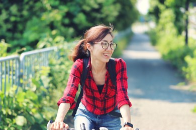 japanese asian women cycling and background of natural trees