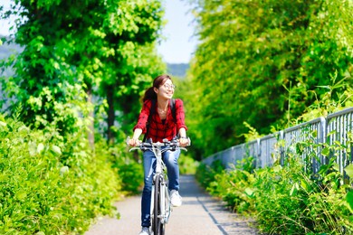 japanese asian women cycling and background of natural trees