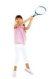 a little girl holds a tennis racket in her hands. game, sports concept.