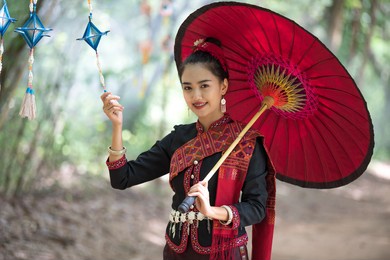 beautiful thai girls with local traditional costumes at the traditional festival