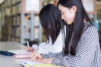 college students studying in the library