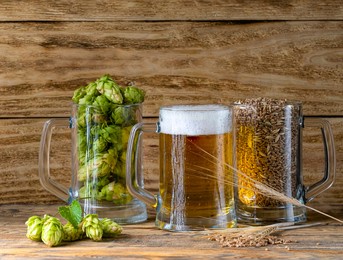 mug with beer and mugs with ingredients for making beer. hop cones and grains in circles