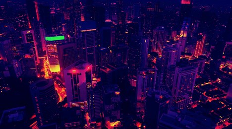 aerial view of the skyscrapers of the city of kuala lumpur in the style of the 80s, neon colors. wide shot 