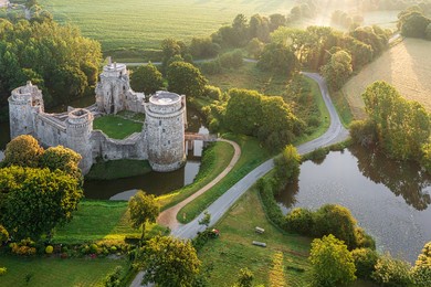 aerial view of the ruins of the hunaudaye castle in cotes d'armor, brittany, france, in sunrise light