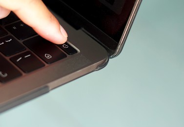 an image select focus button shutdown turn off people finger push switch button saving energy laptop for technology lowering the power on their light of the home interior or work timeout.