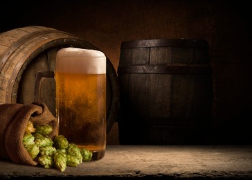 hop twig over old wooden table background. vintage style. beer production ingredient. brewery. fresh-picked whole hops close-up. brewing concept wallpaper.