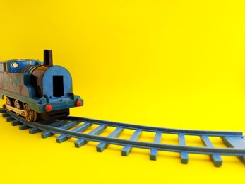 toy train isolated on a yellow background