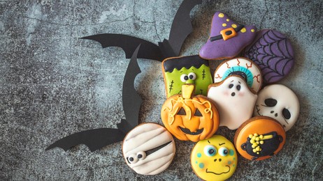 happy halloween! sweets and cookies on the table in the home. preparation for holiday. halloween homemade gingerbread cookies. halloween cookies