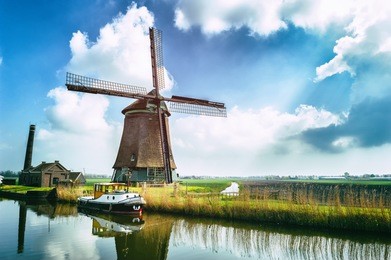 traditional dutch windmill near the canal. netherlands