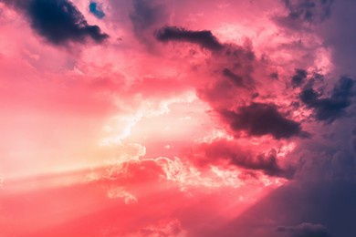 orange sun beam light in red dim sky with dark clouds