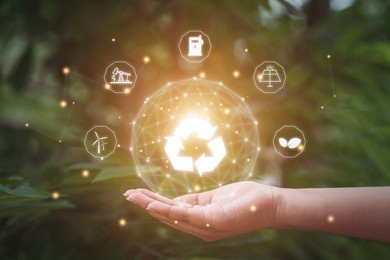 ecology and environment concept. technology hand in hand with environmental icons.