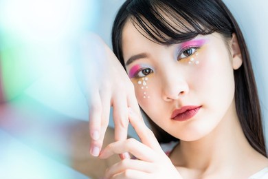 portrait of a young asian girl. colorful makeup. art make up. cosmetics.