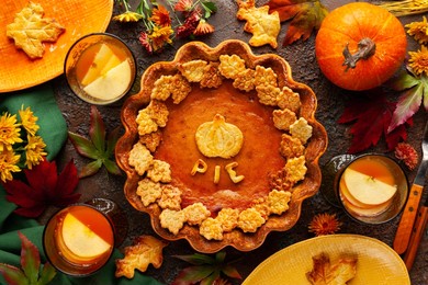 traditional american pumpkin pie for thanksgiving day and apple sangria. top view, copy space. concept thanksgiving table setting