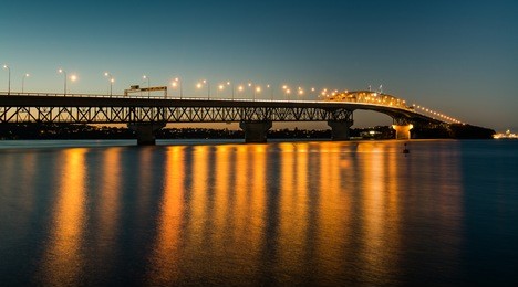 auckland harbour bridge reflecting on the water 