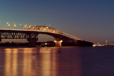 auckland harbour bridge lit up at night