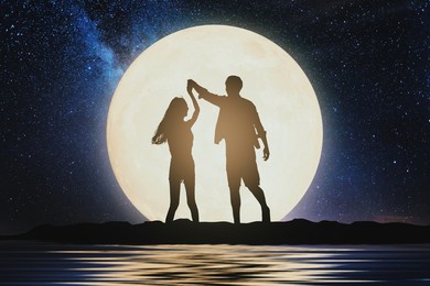 couple silhouette. couple concept. couple dancing on hill with the moon.celebrate mid-autumn festival.