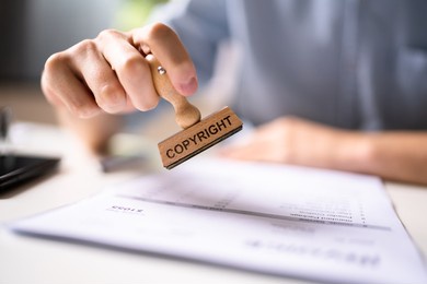 trademark protection rubber stamp on paper in office