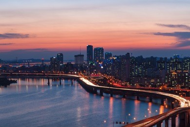 the seoul skyline at sunset, looking toward the yeouido business district.
