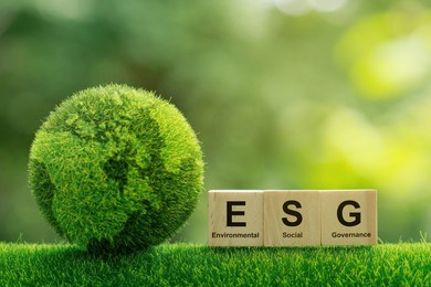esg concept of environmental, social and governance.words esg on a woodblock it is an idea for sustainable organizational development. ​account the environment, society and corporate governance