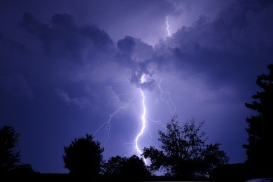 large lightning bolt at night.