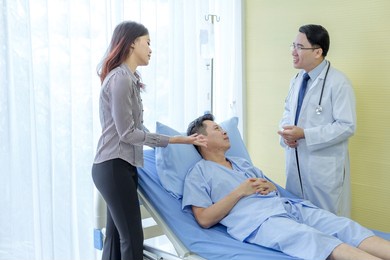 doctor explaining treatment to patient's relative