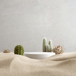 cosmetic background for product presentation, podium display on sand background, 3d rendering.
