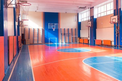 empty gym at college, basketball and football ground