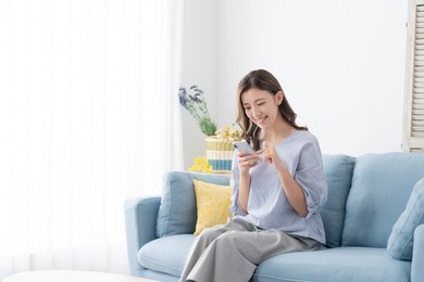 asian young woman using smartphone