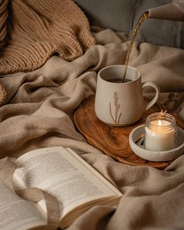  teapot and tee cup on the window in room with candle cozy autumn still life slow living fall pumpkin. high quality photo