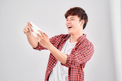 a portrait of surprised young man with mobile phone