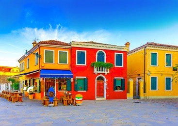 beautiful colorful small houses in a raw at burano island near venice italy
