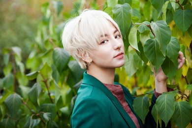 handsome asian man. portrait of a korean fashion guy. young asian modern man or student. full face view. closeup k-pop idol.