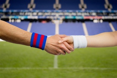 close up handshake of spanish match between barcelona and madrid