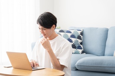asian young man at home