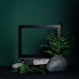 luxurious empty product marble stone podium and forest green leaves on dark background. concept scene stage for promotion, sale, presentation or cosmetic. black minimal mock up template.