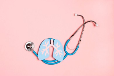 prevention of pulmonary disease. lung symbol and stethoscope on a pink background. healthcare and medicine concept. 