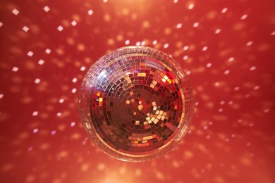 red disco mirror ball in the club party