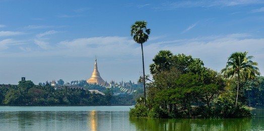 panorama of  shwedagon pagoda over kandawgyi lake in yangon, burma (myanmar)