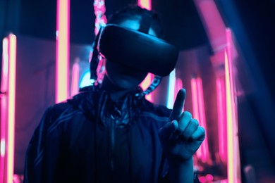 pointing finger with extended reality neon light