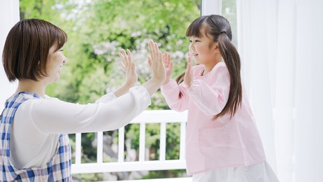 asian nursery teacher and child