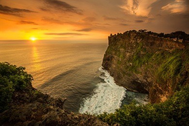 beautiful sunset at uluwatu temple, bali indonesia