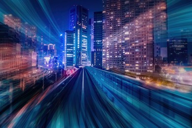 car track with motion effect. car track with motion effect. night city with speed effect. modern city at night symbolizes highways. auto track in downtown of city. downtown of evening metropolis.