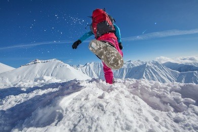 hiker in winter caucasus mountains in georgia, gudauri