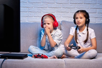 children playing video game with game console
