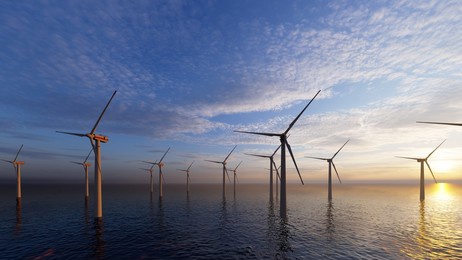 wind power plant towers in sea. energy windwill in dusk ocean at sunset with beautiful golden horizon, 3d rendering. windwill generating alternative energy. 