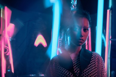 futuristic portrait of asian teenager in neon light with sword like lamps. neon smudged effects applied in front. she is seriour, daring, cyberpunk fashionable girl, in net clothes, white eyebrows