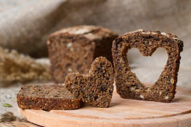 healthy food concept. carved heart from a piece of homemade bread. selective focus on the heart.