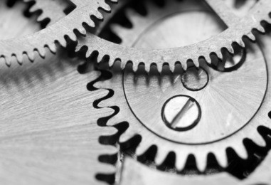 black white background with metal cogwheels a clockwork. macro 