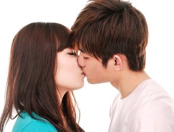 portrait of young kissing couple
